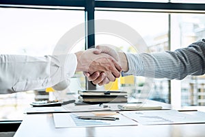 Finishing up a conversation after collaboration, handshake of two business people after contract agreement to become a partner,
