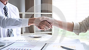 Finishing up a conversation after collaboration, handshake of two business people after success good deal contract negotiation