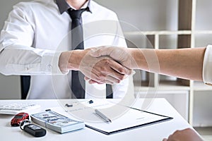 Finishing up of conversation, Realtor agent manager shaking hands with woman client after signing rental form contract agreement,