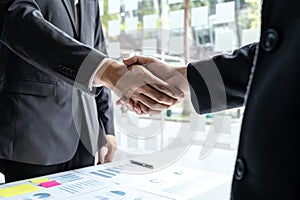 Finishing up a meeting collaboration, handshake of two business people after contract agreement to become a partner, collaborative