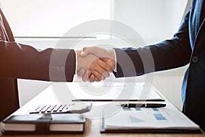 Finishing up a meeting, handshake of two happy business people a