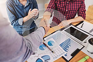 Finishing up a meeting, handshake of two happy business people after contract agreement to become a partner, collaborative