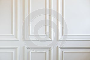 Fragment Of Classic White Walls Decorated With Moldings photo