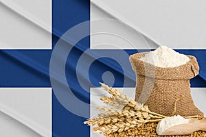 Finlandia grain crisis, Concept global hunger crisis,  On background Flag Finlandia wheat grain. Concept of growing wheat in photo