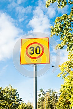 Finnish speed limit sign 30 km h on blue sky background