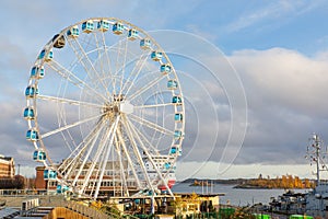 Finnish urban landscape with ferris wheel in Helsinki