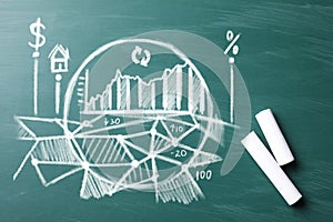 Fintech concept. Charts and chalk on greenboard
