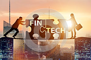 The fintech financial technology concept with puzzle pieces
