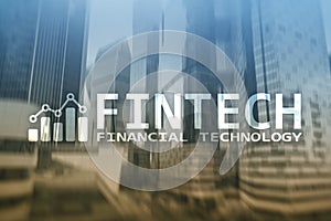 FINTECH - Financial technology, global business and information Internet communication technology. Skyscrapers background. Hi-tech