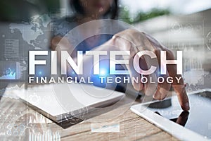 Fintech. Financial technology text on virtual screen. Business, internet and technology concept.