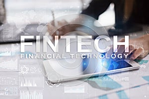 Fintech. Financial technology text on virtual screen. Business, internet and technology concept.