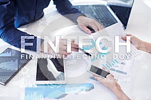 Fintech. Financial technology text on virtual screen. Business, internet and technology concept.