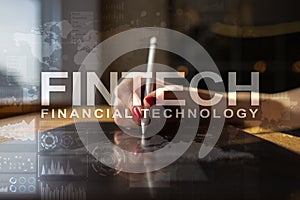 Fintech. Financial technology text on virtual screen. Business, internet and technology concept.