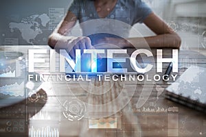 Fintech. Financial technology text on virtual screen. Business, internet and technology concept.