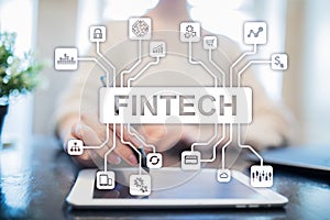 Fintech. Financial technology text on virtual screen. Business, internet and technology concept.