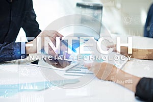 Fintech. Financial technology text on virtual screen. Business, internet and technology concept.