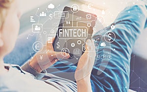 Fintech Theme with man using a tablet photo