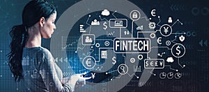 Fintech theme with woman using a tablet photo