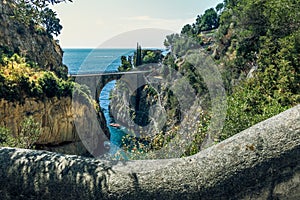 Fiordo di Furore, Amalfi coast, panoramic scenic aerial view to the arched bridge between rocks of fjord, stairs and sea