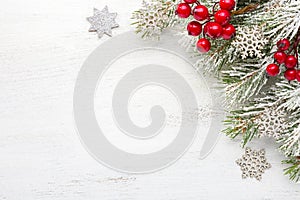 Fir branch with Christmas decorations on old wooden shabby background with empty space for text. Top view photo