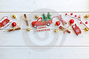 Fir branch with Christmas decorations on old wooden white background with copy space for text