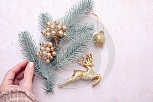 Fir branch with golden Christmas decor