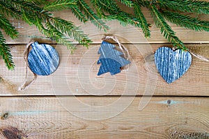 Fir branch with wooden Christmas figures