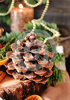 Fir cone wood table with Christmas and Christmas decorations, selective focus