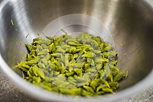 Fir Fresh Tips into an Inox Bowl for a Beer Recipe photo