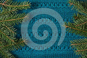 Fir tree as frame on knitted sweater background. Christmas concept. Abstract pattern.