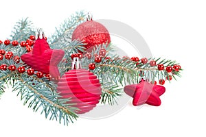 Fir tree branch and red decorations