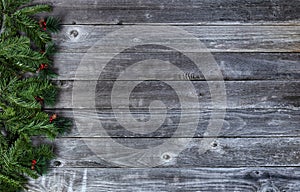 Fir tree branches on wood planks for a merry Christmas or happy New Year holiday celebration concept