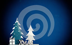 fir trees on a blue background Christmas decoration