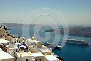 Fira village roofs and boats