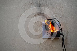 On fire adapter at plug Receptacle on white background