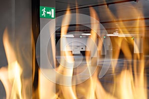 Fire against emergency exit sign