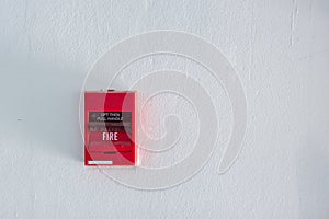 fire alarm box on cement wall for warning and security system in the condominium place.
