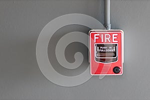 Fire alarm box on cement wall for warning and security system in the condominium place. standard safety in the resident, shopping