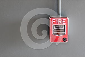 Fire alarm box on cement wall for warning and security system in the condominium place. standard safety in the resident, shopping