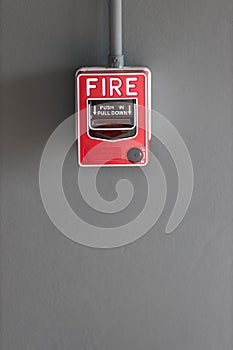 Fire alarm box on cement wall for warning and security system in the condominium place. standard safety in the resident, shopping