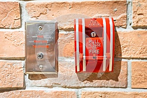 Fire alarm on a brick wall