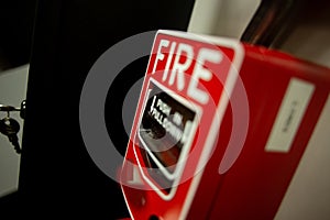 Fire alarm and mock sprinkler system attached to a white wall used for training