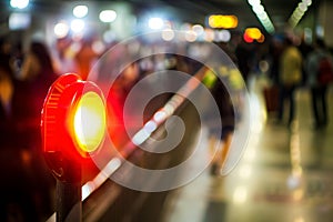 fire alarm strobe flashing in crowded public area