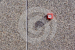 Fire alarm switch on brick wall texture background