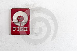 Fire alarm switch on the Dirty white walls