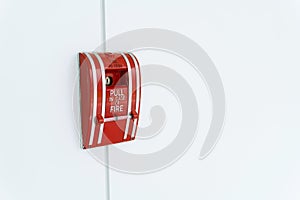 Fire alarm switch on the white wall