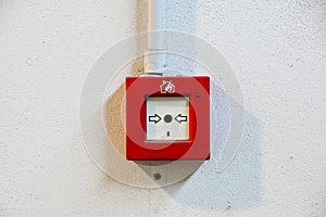 Fire alarm switch on white wall