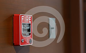 Fire alarm switch on wooden wall with copy space. warning and security system concept
