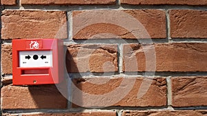 Fire alarm system box installed on wall in building