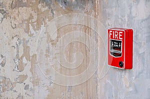 Fire alarm system box installed on wall in old building
